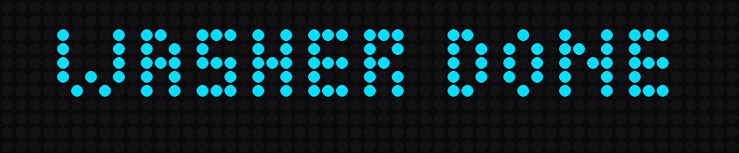 The LED panel showing the words WASHER DONE in cyan capitals